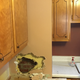 The first hole I made. I knew the brick chimney had to be there somewhere, so I found it. The kitchen gained 14 inches of countertop.